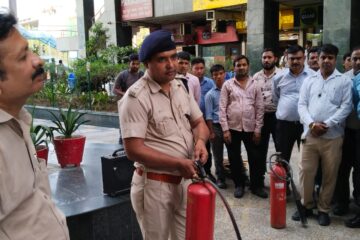 A fire Officer giving training on Fore Extinguisher