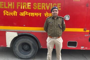 Fire Officer Standing near Fire Truck