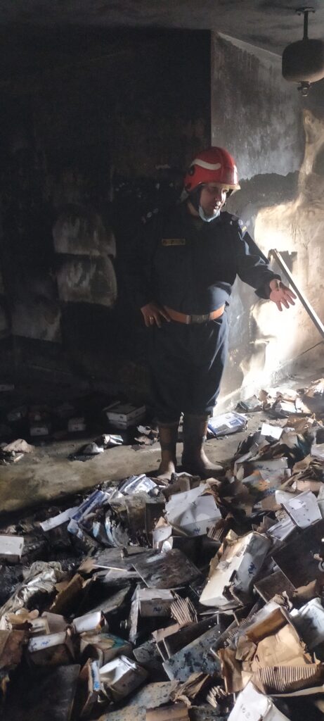 Firefighting Challenges: fire officer instructing his staff during firefighting operations